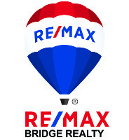 RE/MAX Bridge Realty Company Logo